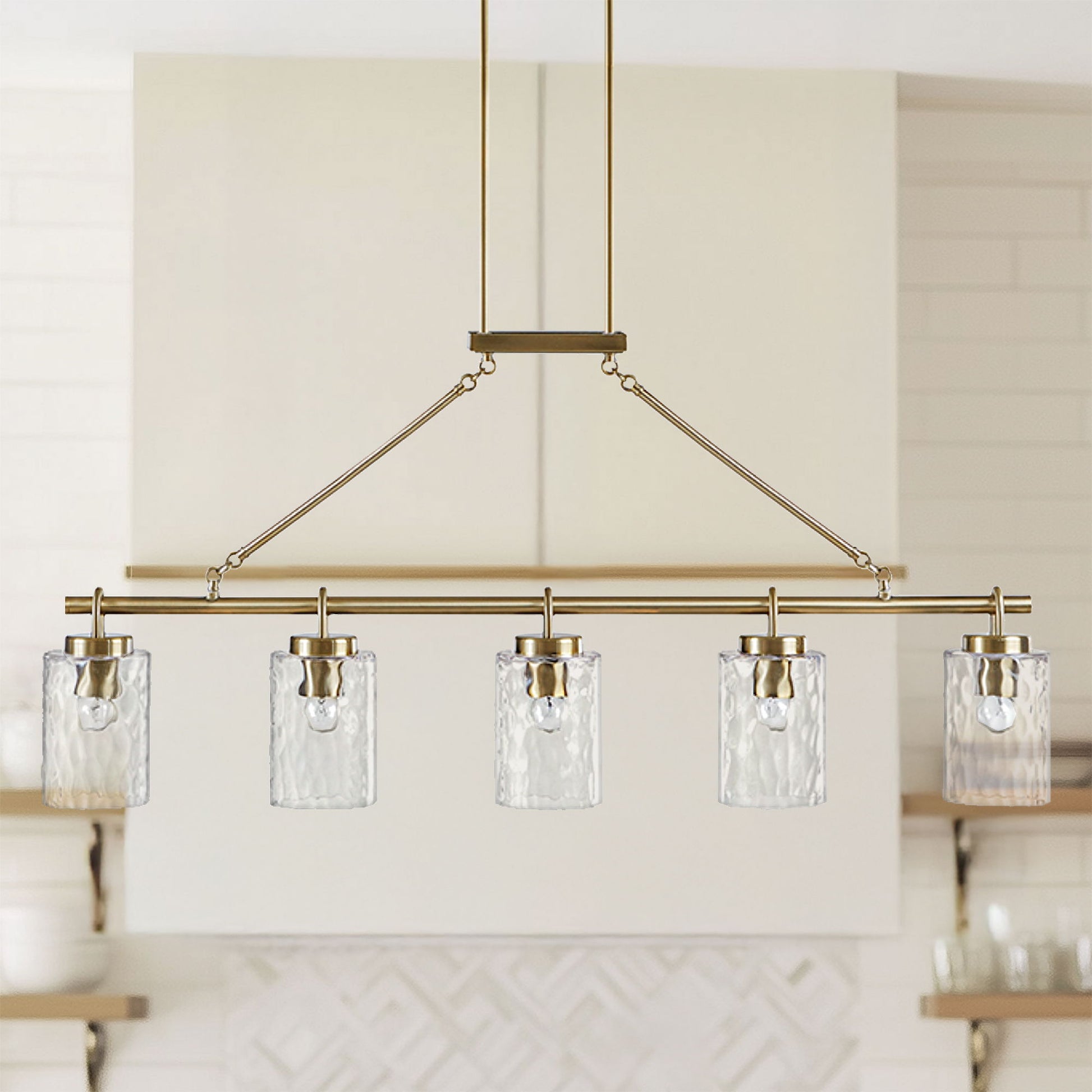 Curiana - 5-Light Linear Chandelier With Textured Glass Shades - Antique Brass